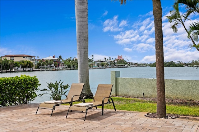 131 N Tessier Dr, St Pete Beach, FL 33706 - view of patio / terrace featuring a water view