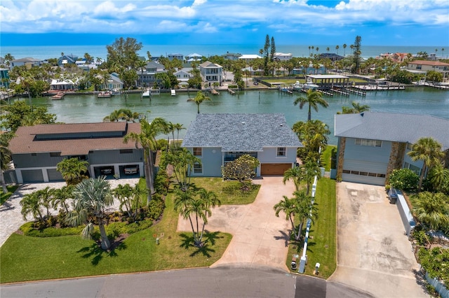 131 N Tessier Dr, St Pete Beach, FL 33706 - aerial view of residential area with a nearby body of water