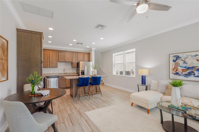527 Jetstar Ln, Oldsmar, FL 34677 - living area featuring crown molding, recessed lighting, light wood finished floors, and a ceiling fan