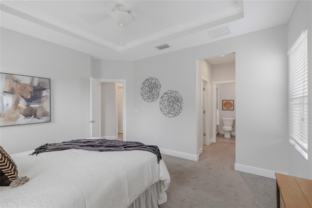 527 Jetstar Ln, Oldsmar, FL 34677 - bedroom featuring light colored carpet, a tray ceiling, and attic access