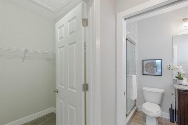 527 Jetstar Ln, Oldsmar, FL 34677 - bathroom featuring a shower stall, vanity, and a spacious closet