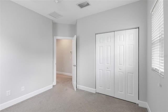 527 Jetstar Ln, Oldsmar, FL 34677 - unfurnished bedroom featuring carpet floors and a closet