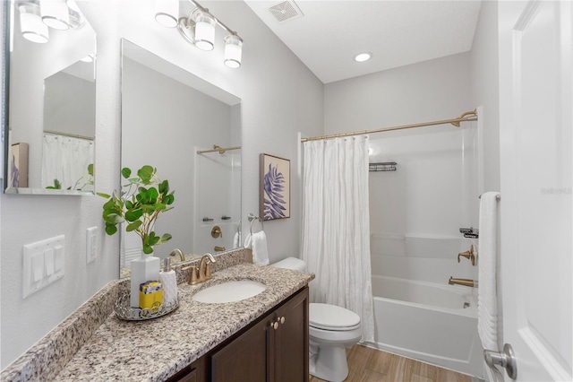 527 Jetstar Ln, Oldsmar, FL 34677 - bathroom featuring wood finished floors, vanity, and shower / bathtub combination with curtain