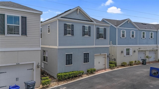 527 Jetstar Ln, Oldsmar, FL 34677 - view of front of house with an attached garage and stucco siding