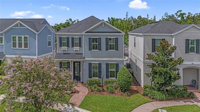527 Jetstar Ln, Oldsmar, FL 34677 - view of front facade featuring a shingled roof
