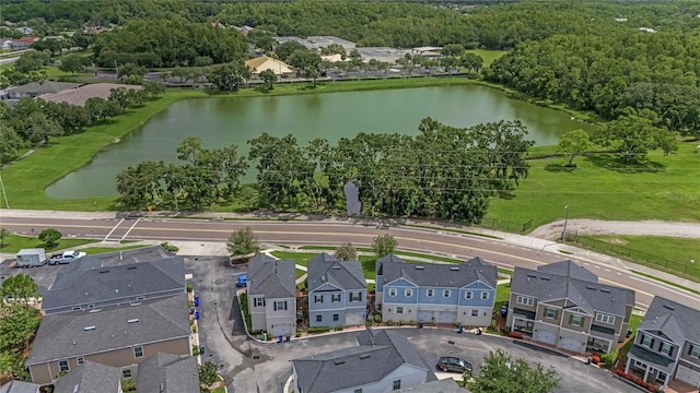 527 Jetstar Ln, Oldsmar, FL 34677 - aerial perspective of suburban area featuring a nearby body of water and a heavily wooded area