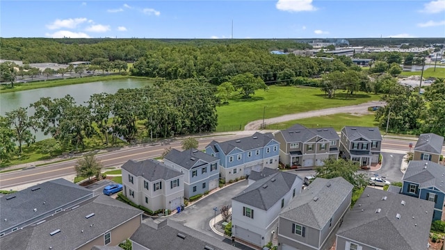 527 Jetstar Ln, Oldsmar, FL 34677 - aerial view of residential area with a nearby body of water and a heavily wooded area