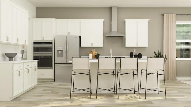 6913 116th Ct E, Palmetto, FL 34221 - kitchen featuring fridge with ice dispenser, wall chimney range hood, double oven, light wood-type flooring, and white cabinetry