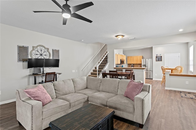 4715 Barnstead Dr, Riverview, FL 33578 - living area featuring a ceiling fan, wood finished floors, stairway, and recessed lighting