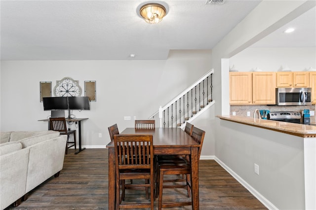 4715 Barnstead Dr, Riverview, FL 33578 - dining room with dark wood-type flooring, stairs, and recessed lighting