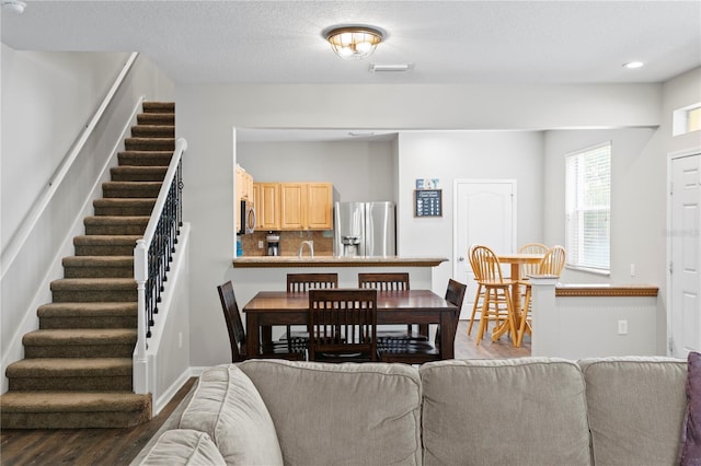 4715 Barnstead Dr, Riverview, FL 33578 - living room featuring wood finished floors, stairs, and recessed lighting