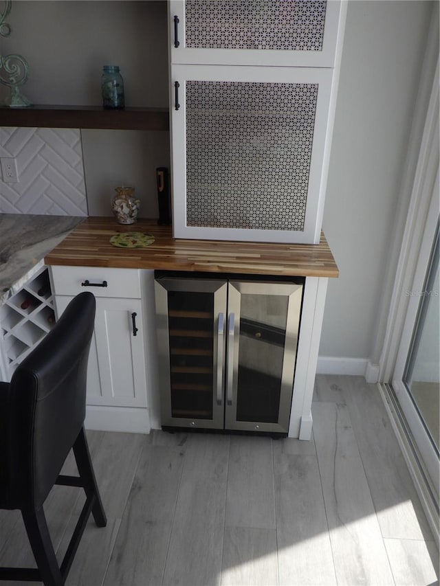 17408 Gulf Blvd Unit 601, Redington Shores, FL 33708 - bar with beverage cooler and light wood-style flooring