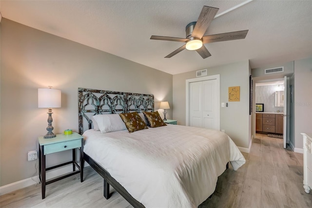 17408 Gulf Blvd Unit 601, Redington Shores, FL 33708 - bedroom featuring light wood-type flooring, a closet, and ceiling fan