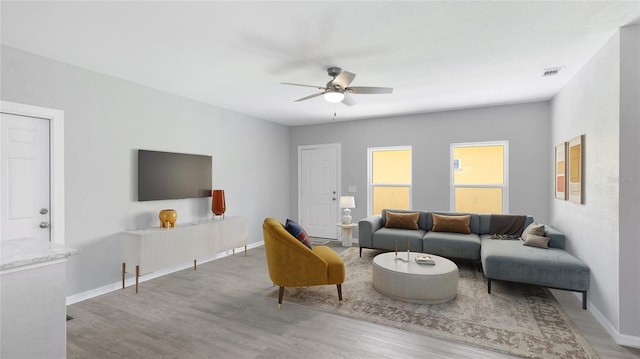 3051 27th Ct E, Palmetto, FL 34221 - living room featuring a ceiling fan and wood finished floors