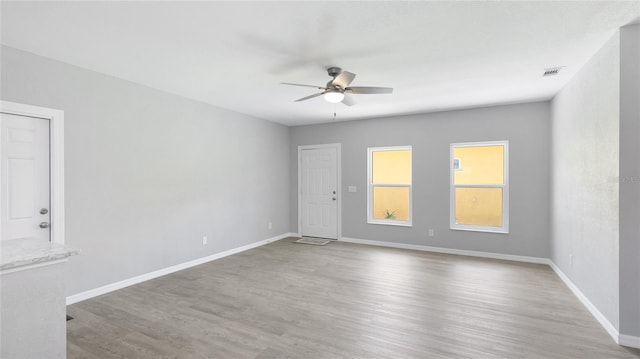 3051 27th Ct E, Palmetto, FL 34221 - spare room with a ceiling fan and wood finished floors