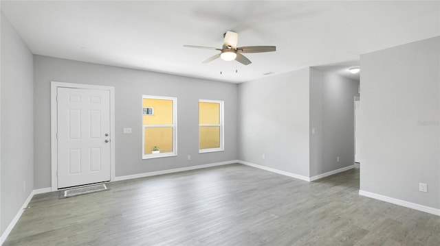 3051 27th Ct E, Palmetto, FL 34221 - unfurnished room featuring a ceiling fan and wood finished floors