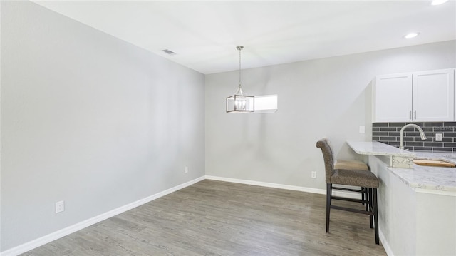 3051 27th Ct E, Palmetto, FL 34221 - dining room featuring light wood-style floors, a chandelier, and recessed lighting