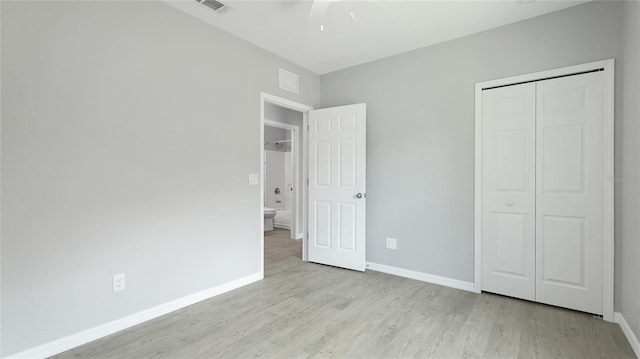 3051 27th Ct E, Palmetto, FL 34221 - unfurnished bedroom with wood finished floors, a closet, and ceiling fan