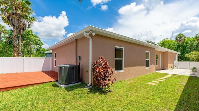 3051 27th Ct E, Palmetto, FL 34221 - view of side of property featuring stucco siding, a fenced backyard, a deck, and a patio area