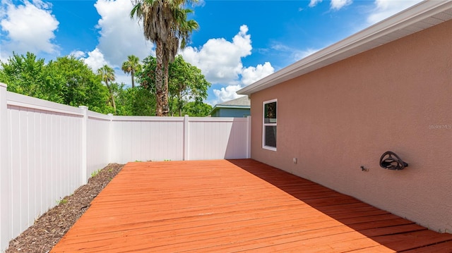 3051 27th Ct E, Palmetto, FL 34221 - wooden deck featuring a fenced backyard