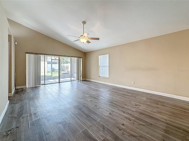 1741 Oak Spring Dr, Tarpon Springs, FL 34689 - spare room with a ceiling fan, dark wood-style flooring, and vaulted ceiling