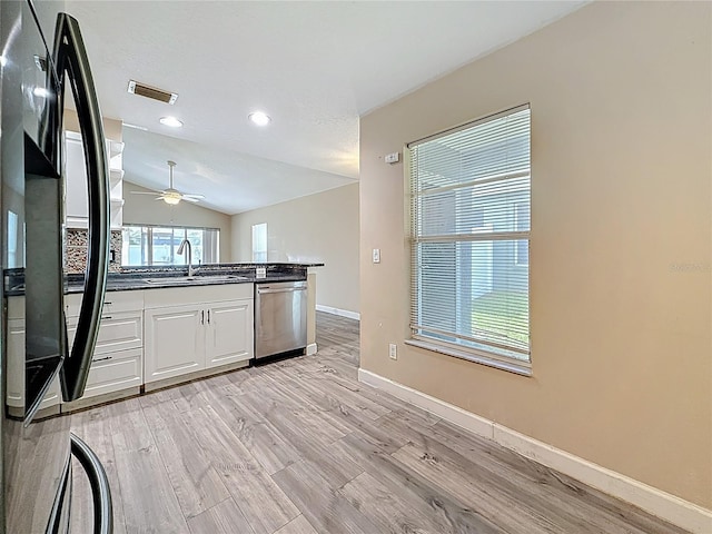 1741 Oak Spring Dr, Tarpon Springs, FL 34689 - kitchen featuring dishwasher, dark countertops, ceiling fan, light wood-style flooring, and recessed lighting