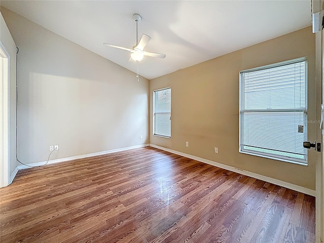 1741 Oak Spring Dr, Tarpon Springs, FL 34689 - unfurnished room with lofted ceiling, wood finished floors, and ceiling fan