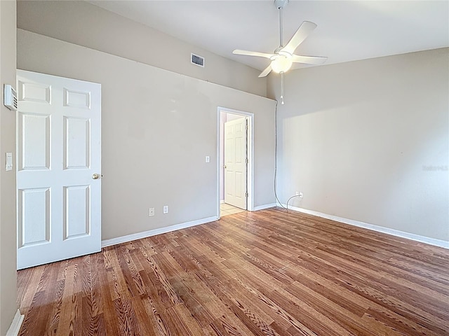 1741 Oak Spring Dr, Tarpon Springs, FL 34689 - spare room featuring ceiling fan and wood finished floors