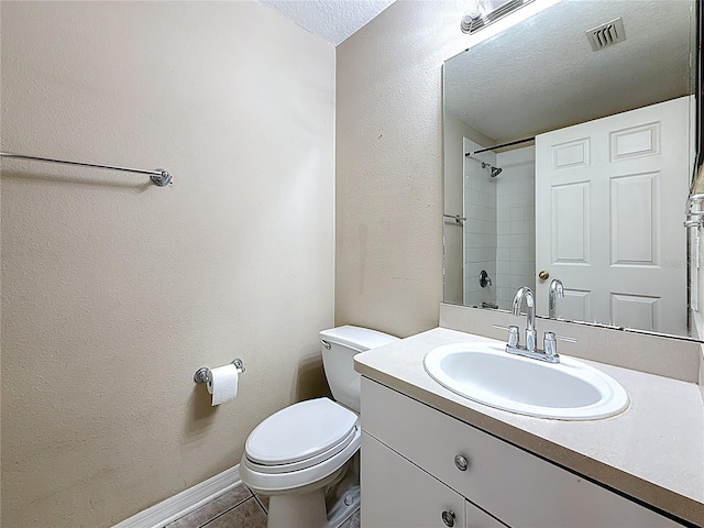 1741 Oak Spring Dr, Tarpon Springs, FL 34689 - bathroom featuring vanity, a textured ceiling, a textured wall, and tile patterned floors