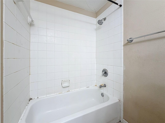 1741 Oak Spring Dr, Tarpon Springs, FL 34689 - full bath featuring tub / shower combination and a textured wall