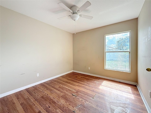 1741 Oak Spring Dr, Tarpon Springs, FL 34689 - spare room featuring wood finished floors and ceiling fan