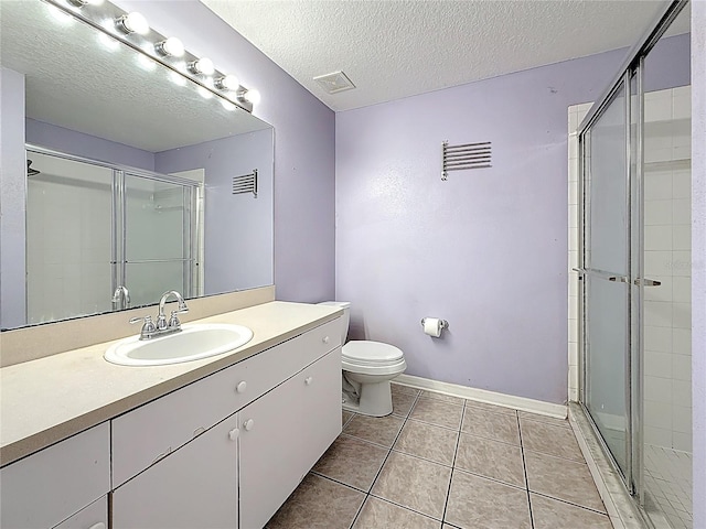1741 Oak Spring Dr, Tarpon Springs, FL 34689 - full bathroom featuring a stall shower, vanity, tile patterned floors, and a textured ceiling