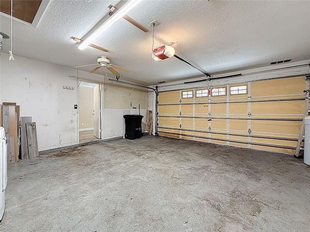 1741 Oak Spring Dr, Tarpon Springs, FL 34689 - garage with a garage door opener and ceiling fan