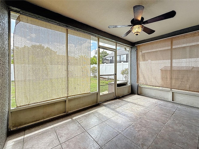 1741 Oak Spring Dr, Tarpon Springs, FL 34689 - unfurnished sunroom featuring ceiling fan
