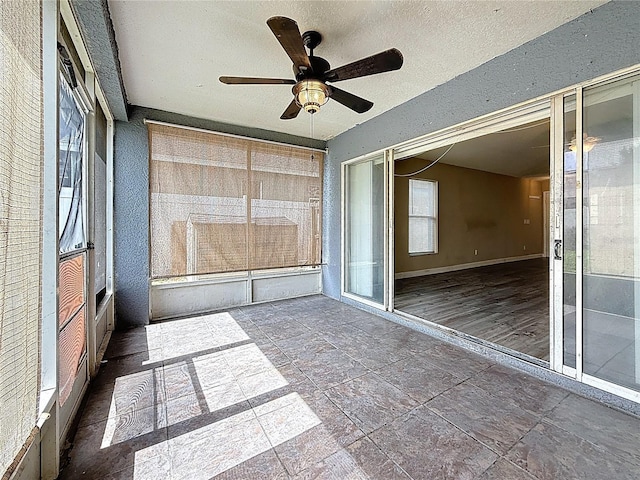 1741 Oak Spring Dr, Tarpon Springs, FL 34689 - unfurnished sunroom with a ceiling fan
