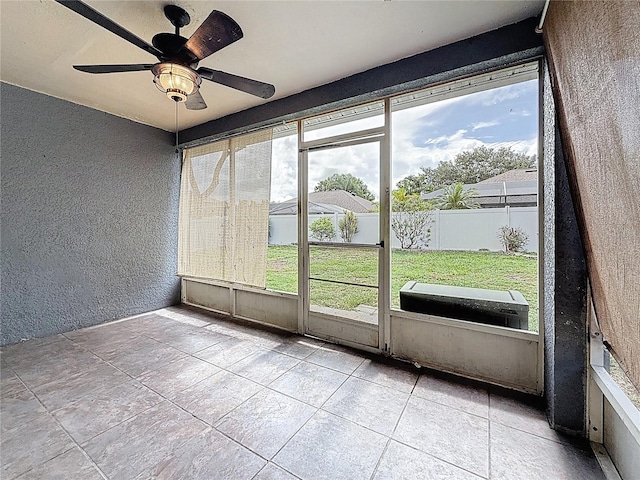1741 Oak Spring Dr, Tarpon Springs, FL 34689 - unfurnished sunroom with healthy amount of natural light and ceiling fan