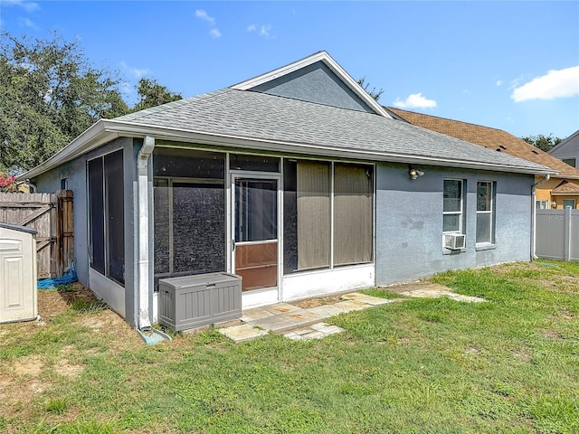 1741 Oak Spring Dr, Tarpon Springs, FL 34689 - back of property with a sunroom, roof with shingles, cooling unit, and stucco siding
