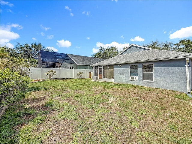 1741 Oak Spring Dr, Tarpon Springs, FL 34689 - fenced yard with a sunroom and cooling unit