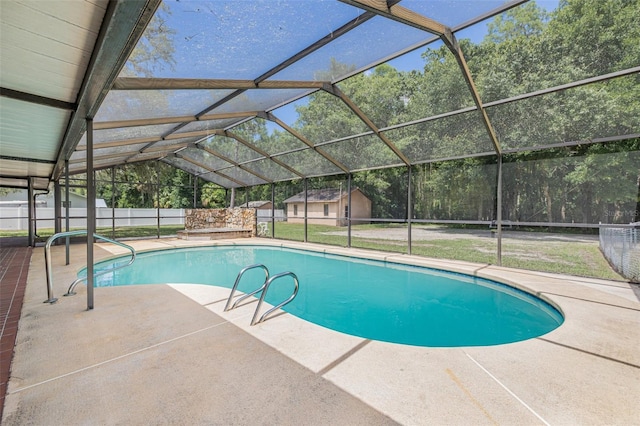 10430 Bobcat Dr, New Port Richey, FL 34654 - view of pool featuring a patio area, a shed, a lanai, and view of wooded area