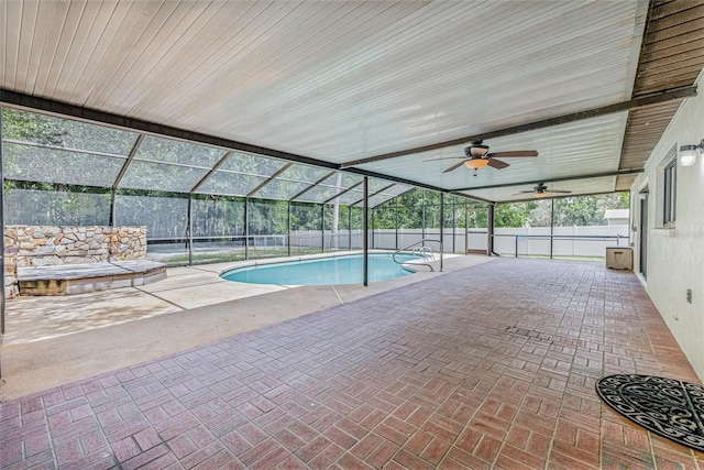 10430 Bobcat Dr, New Port Richey, FL 34654 - view of swimming pool featuring ceiling fan, a patio area, glass enclosure, and a fenced backyard