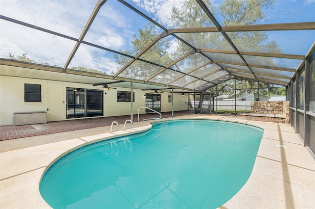 10430 Bobcat Dr, New Port Richey, FL 34654 - view of pool featuring a ceiling fan, a patio area, and a lanai