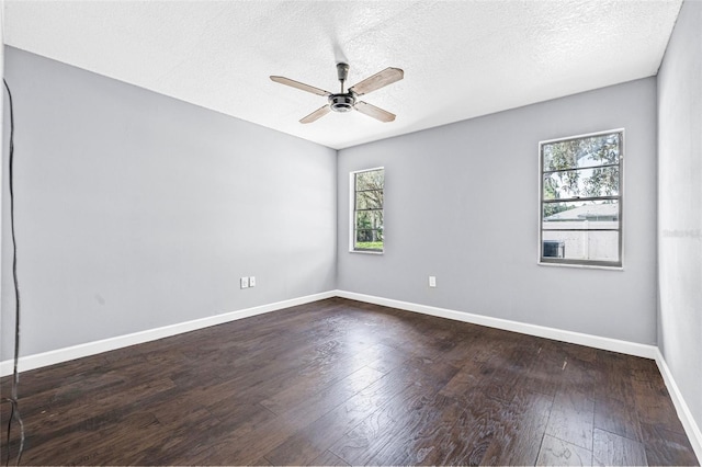 10430 Bobcat Dr, New Port Richey, FL 34654 - unfurnished room with ceiling fan, dark wood-type flooring, and a textured ceiling