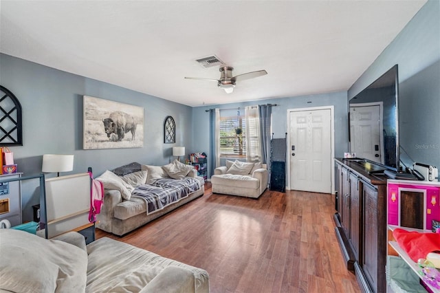 6101 Broken Arrow Dr, New Port Richey, FL 34653 - living room with wood finished floors and ceiling fan