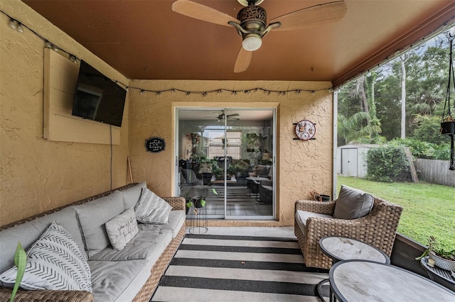 6101 Broken Arrow Dr, New Port Richey, FL 34653 - view of exterior entry featuring stucco siding, an outdoor hangout area, ceiling fan, and a lawn