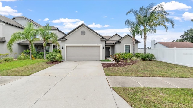 14317 Italia Dr, Wimauma, FL 33598 - ranch-style house with a garage, stucco siding, and concrete driveway