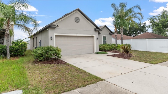 14317 Italia Dr, Wimauma, FL 33598 - single story home with stucco siding, a garage, and concrete driveway