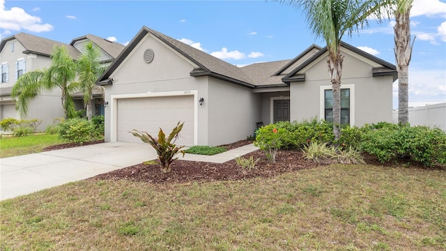 14317 Italia Dr, Wimauma, FL 33598 - view of front of home with a garage, stucco siding, driveway, a front yard, and a shingled roof