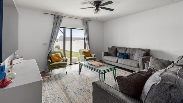 14317 Italia Dr, Wimauma, FL 33598 - living area with a ceiling fan and wood finished floors