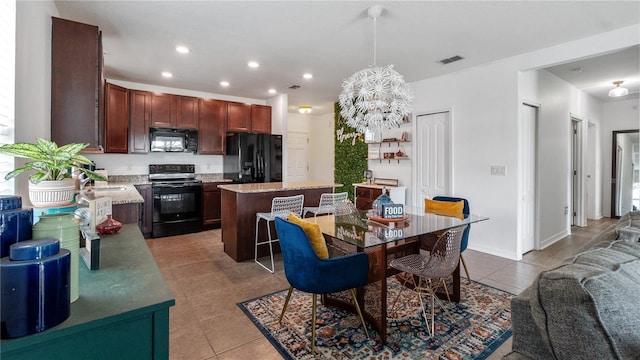 14317 Italia Dr, Wimauma, FL 33598 - dining room with light tile patterned flooring, a chandelier, and recessed lighting
