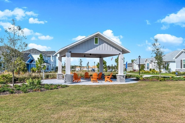 28792 Rambutan Dr, Wesley Chapel, FL 33543 - view of grassy yard featuring a ceiling fan, a residential view, a gazebo, and a patio